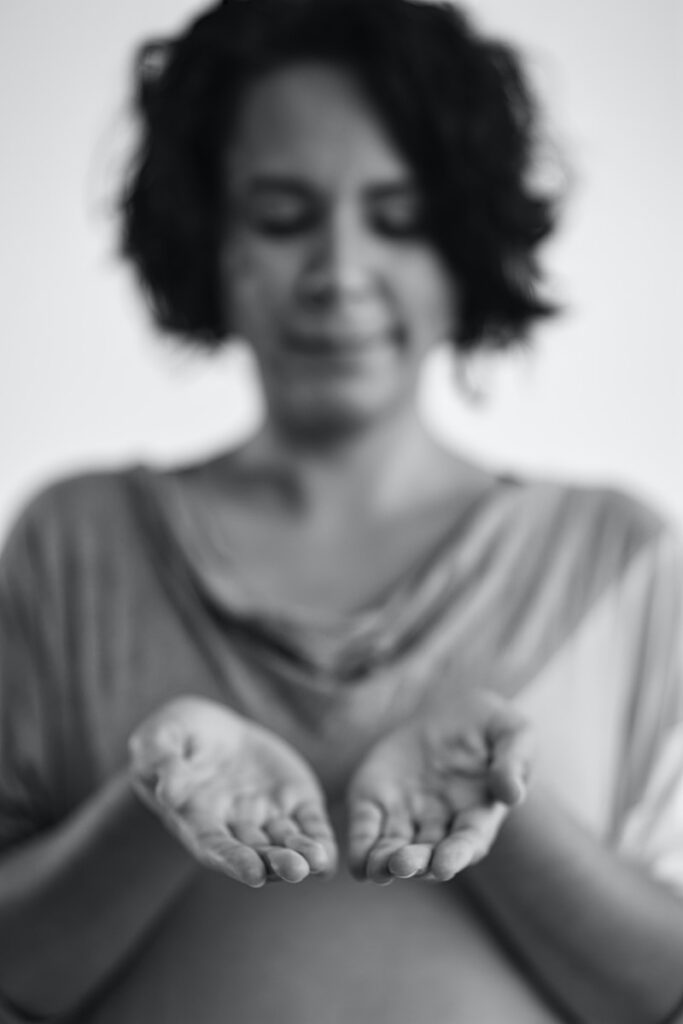 woman in crew neck shirt holding baby